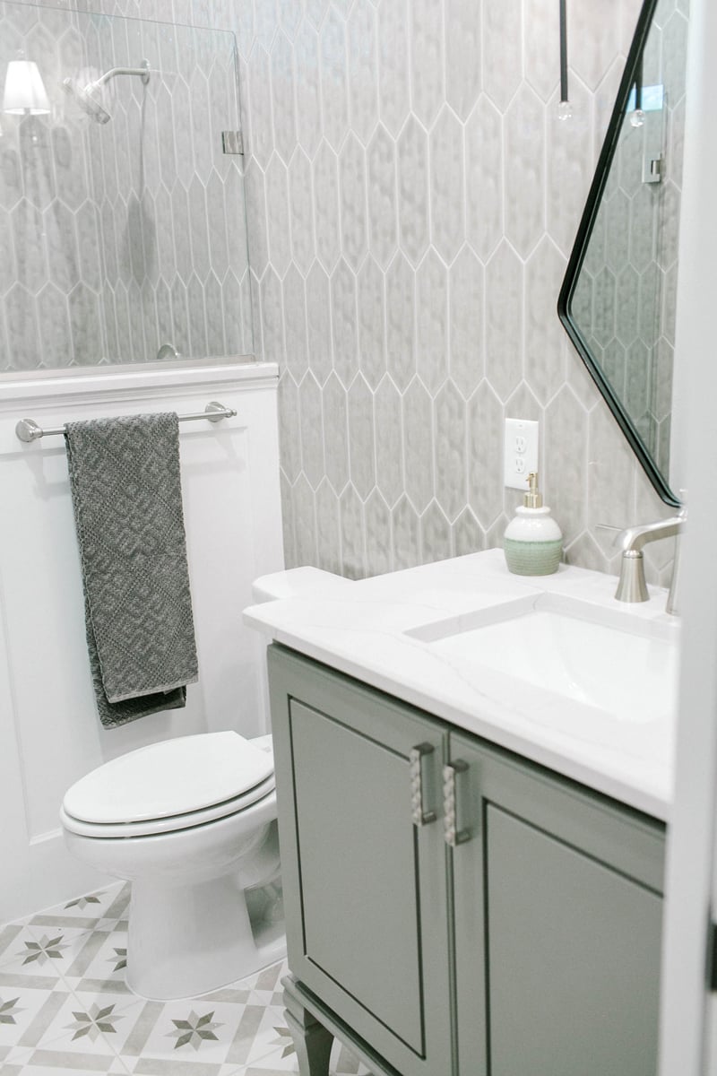 guest bathroom with tiled wall